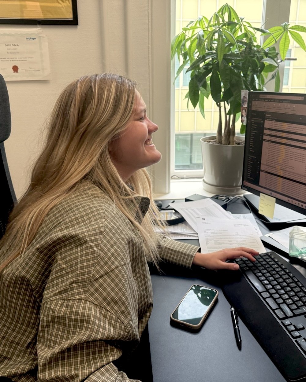 A colleague at her desk in the Aarhus office